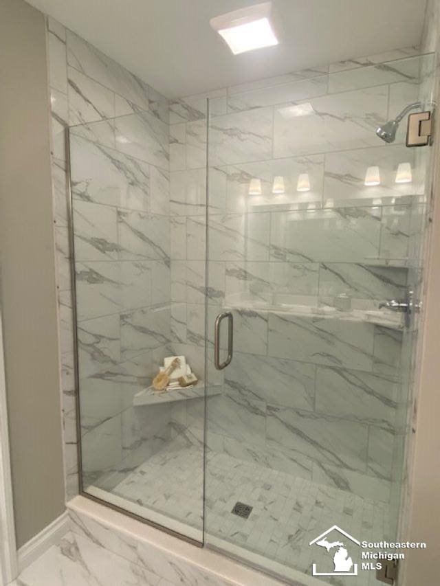 8260 Grande Lake Cir, Temperance, MI 48182 - full bathroom with a marble finish shower and marble finish floors