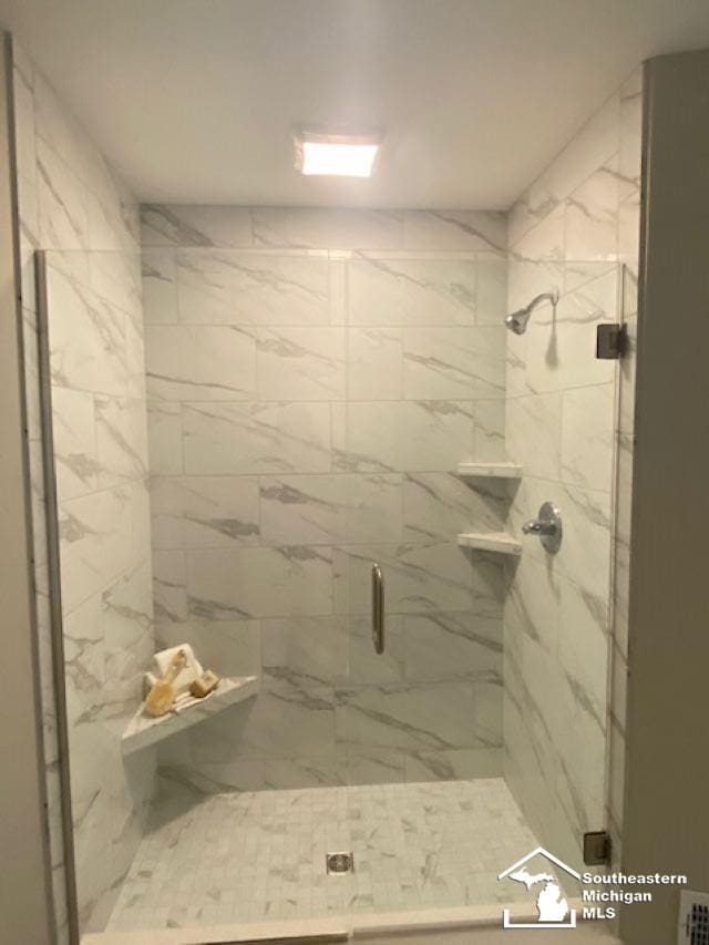 8260 Grande Lake Cir, Temperance, MI 48182 - full bath featuring a marble finish shower