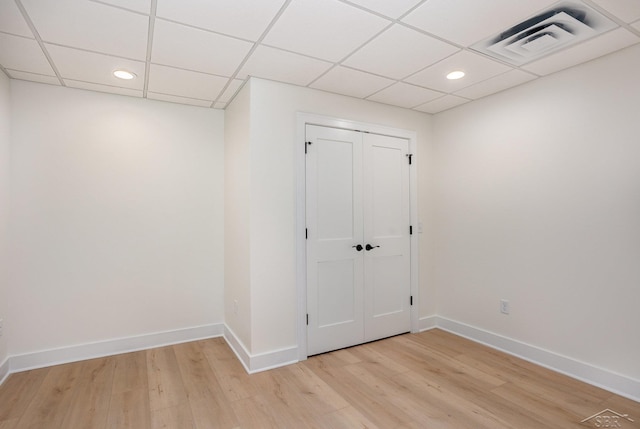 9841 Beech Tree Ln, Frankenmuth, MI 48734 - basement featuring light wood-type flooring, a drop ceiling, and recessed lighting