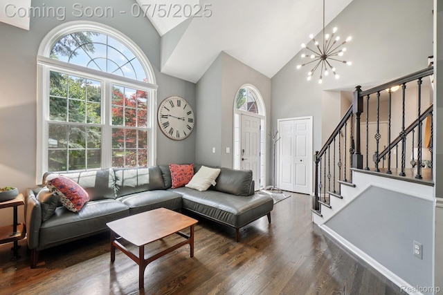 678 Twin Oaks Ct, Rochester Hills, MI 48307 - living room with high vaulted ceiling, a chandelier, wood finished floors, and stairway