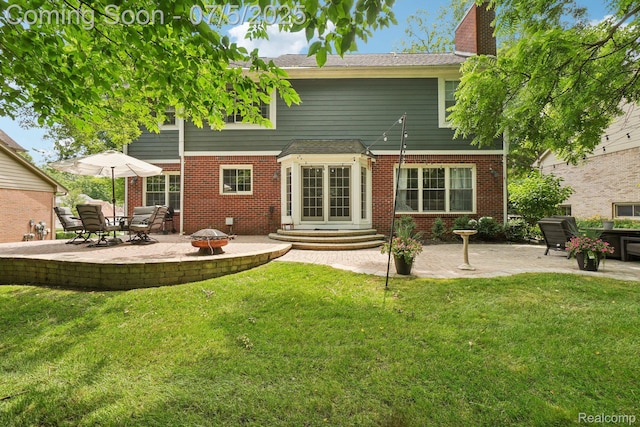 678 Twin Oaks Ct, Rochester Hills, MI 48307 - rear view of property featuring an outdoor fire pit, a patio, and a yard
