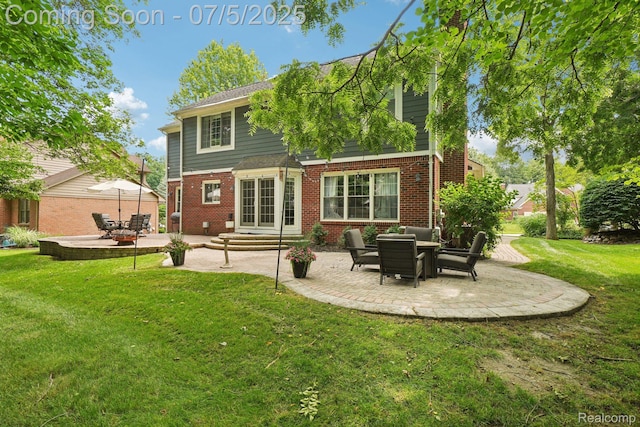 678 Twin Oaks Ct, Rochester Hills, MI 48307 - rear view of property featuring a patio, a yard, brick siding, and entry steps