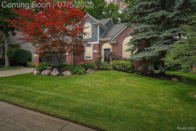 678 Twin Oaks Ct, Rochester Hills, MI 48307 - view of front of property with a front lawn, driveway, and brick siding