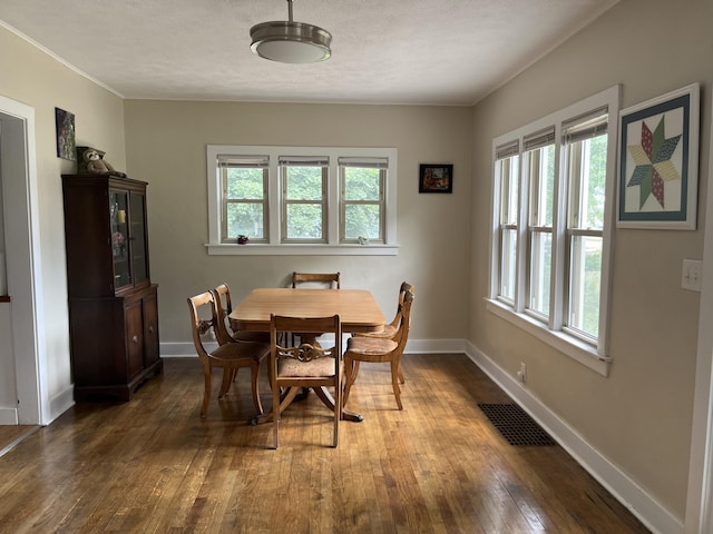 3925 Miramar Ave NE, Grand Rapids, MI 49525 - dining room with hardwood / wood-style floors and crown molding
