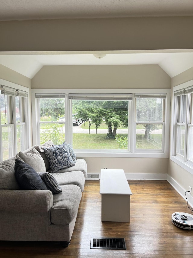 3925 Miramar Ave NE, Grand Rapids, MI 49525 - living room with lofted ceiling and wood finished floors