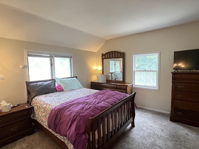 3925 Miramar Ave NE, Grand Rapids, MI 49525 - carpeted bedroom featuring lofted ceiling and baseboards