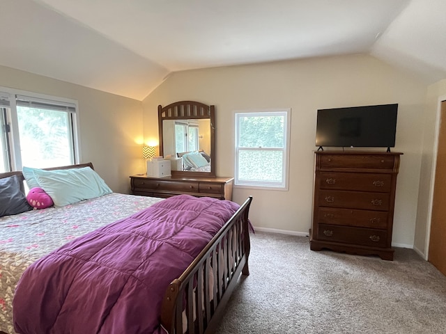 3925 Miramar Ave NE, Grand Rapids, MI 49525 - carpeted bedroom with lofted ceiling and multiple windows