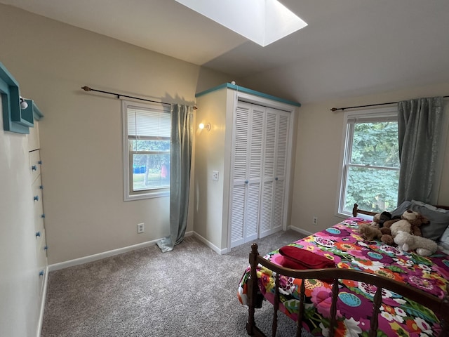 3925 Miramar Ave NE, Grand Rapids, MI 49525 - carpeted bedroom with a skylight, vaulted ceiling, and a closet