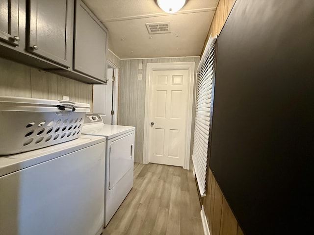 333 E Lakewood Blvd Unit 315, Holland, MI 49424 - laundry room featuring cabinet space, separate washer and dryer, and light wood-type flooring