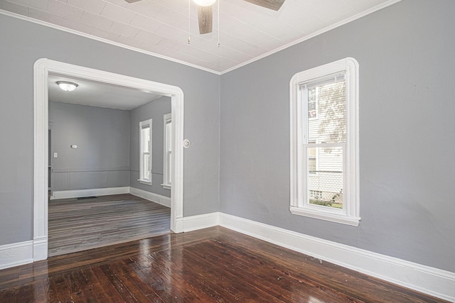 816 Oakhill St SE, Grand Rapids, MI 49507 - unfurnished room featuring wood-type flooring, crown molding, and ceiling fan