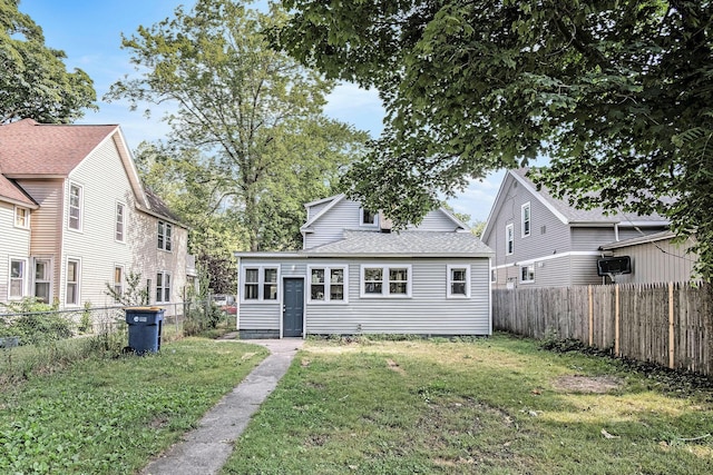 816 Oakhill St SE, Grand Rapids, MI 49507 - back of property featuring a fenced backyard and roof with shingles