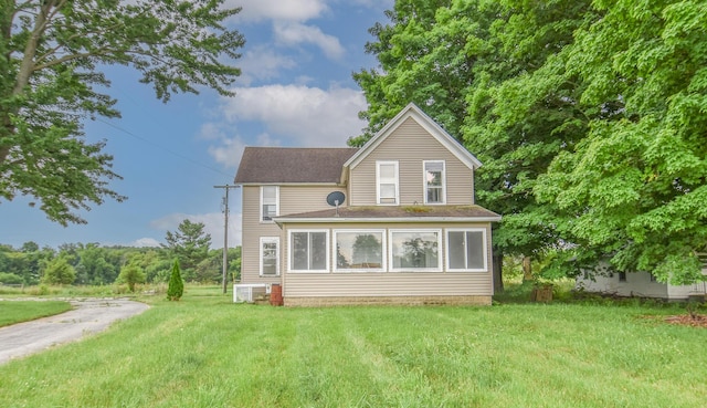 1085 E Chicago Rd Unit A, Quincy, MI 49082 - back of property featuring a lawn and a shingled roof