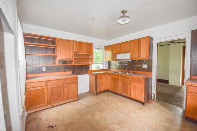 1085 E Chicago Rd Unit A, Quincy, MI 49082 - kitchen featuring open shelves, tasteful backsplash, and tile counters