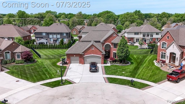 15330 Prentice Ct, Macomb, MI 48042 - view of front of home with concrete driveway, a residential view, a front yard, and an attached garage