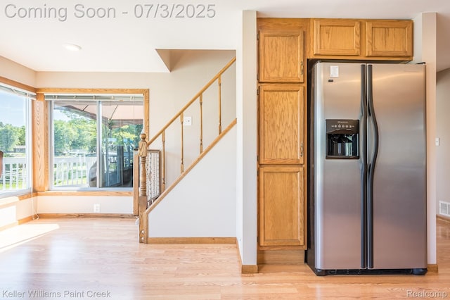 1379 Sioux St, Gladwin, MI 48624 - kitchen featuring stainless steel fridge, light wood finished floors, brown cabinets, and recessed lighting
