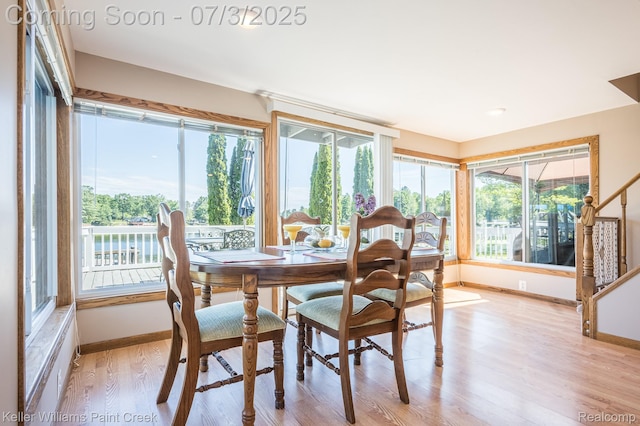 1379 Sioux St, Gladwin, MI 48624 - dining space featuring light wood-style flooring and plenty of natural light