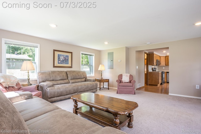 1379 Sioux St, Gladwin, MI 48624 - living area featuring light colored carpet, recessed lighting, and electric panel