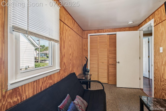 1472 Ready Ave, Burton, MI 48529 - living area with carpet floors and wooden walls