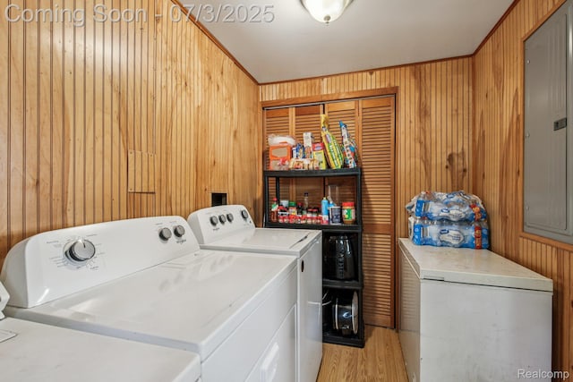 1472 Ready Ave, Burton, MI 48529 - washroom featuring independent washer and dryer, wood walls, and light wood finished floors