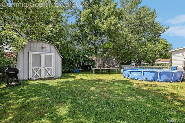 1472 Ready Ave, Burton, MI 48529 - view of yard featuring a trampoline and a shed