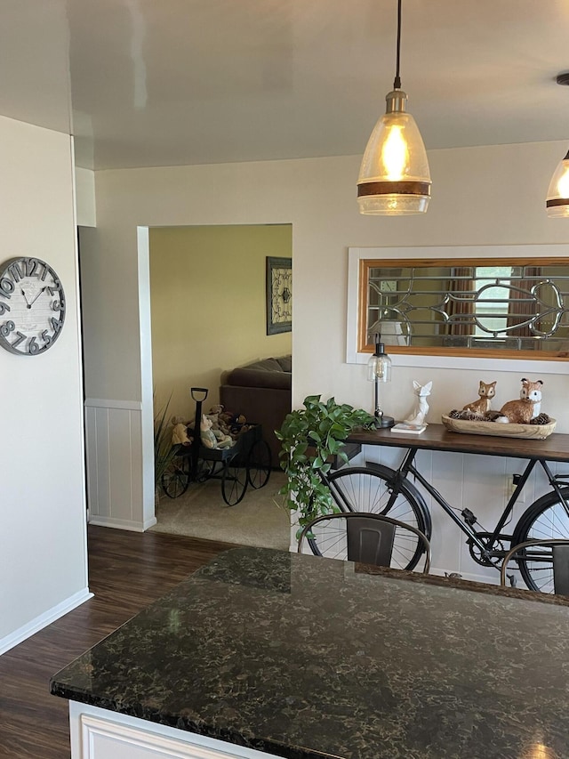 8441 Homerich Ave, Byron Center, MI 49315 - dining area featuring wood finished floors and a wainscoted wall
