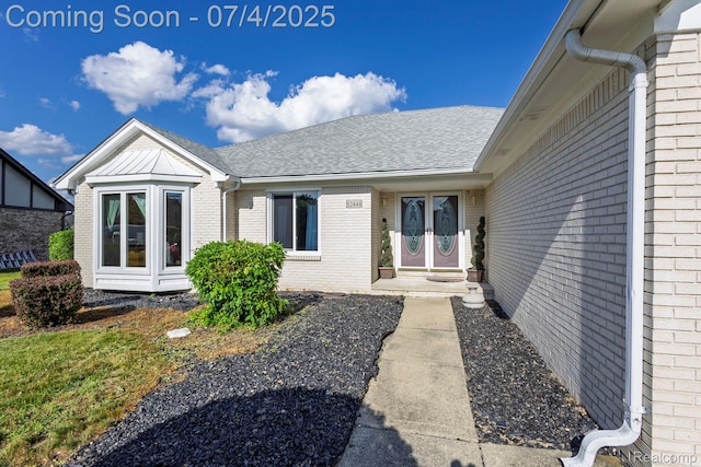 52448 Cedar Mill Dr, Macomb, MI 48042 - entrance to property with brick siding and a shingled roof