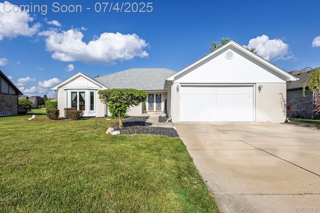 52448 Cedar Mill Dr, Macomb, MI 48042 - ranch-style house featuring driveway, a front lawn, brick siding, a garage, and french doors