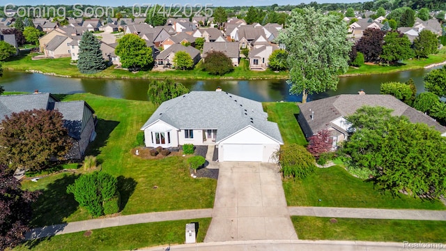 52448 Cedar Mill Dr, Macomb, MI 48042 - aerial perspective of suburban area featuring a nearby body of water