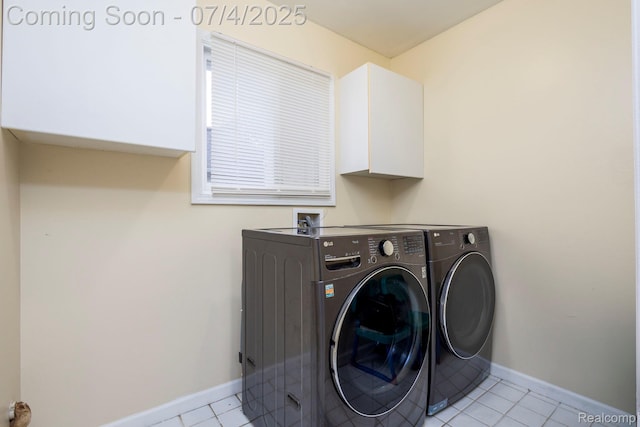 52448 Cedar Mill Dr, Macomb, MI 48042 - washroom with washer and clothes dryer, light tile patterned floors, and cabinet space