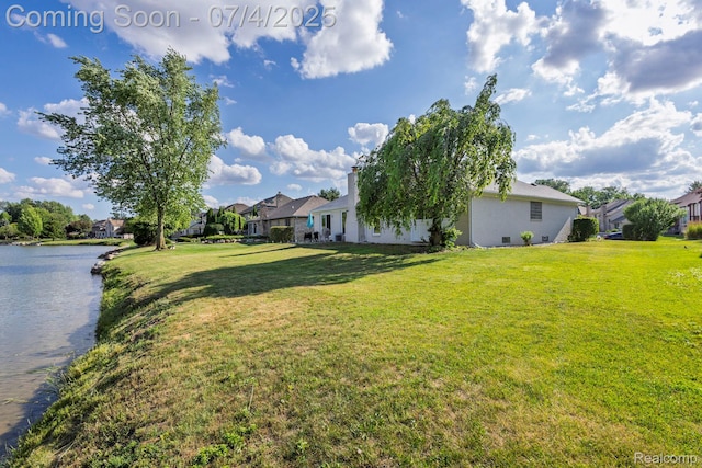 52448 Cedar Mill Dr, Macomb, MI 48042 - view of grassy yard featuring a residential view and a water view