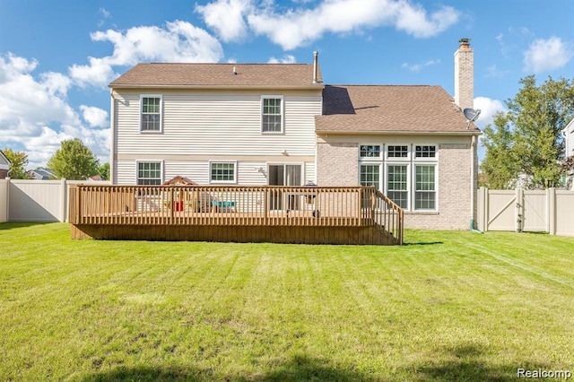 44569 Greenbriar Ct St, Van Buren, MI 48111 - rear view of house featuring a gate, a fenced backyard, a chimney, and a wooden deck