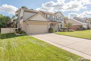 44569 Greenbriar Ct St, Van Buren, MI 48111 - traditional-style house with an attached garage, concrete driveway, and a front yard