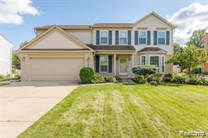 44569 Greenbriar Ct St, Van Buren, MI 48111 - traditional-style home with an attached garage, driveway, and a front yard