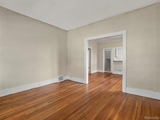 12667 Lauder St, Detroit, MI 48227 - spare room with baseboards and wood-type flooring