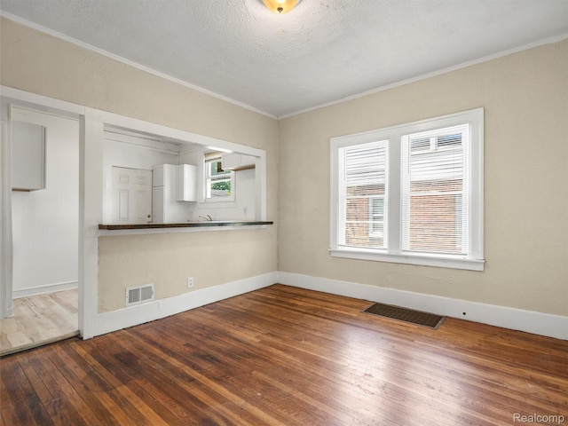 12667 Lauder St, Detroit, MI 48227 - empty room with ornamental molding and hardwood / wood-style flooring
