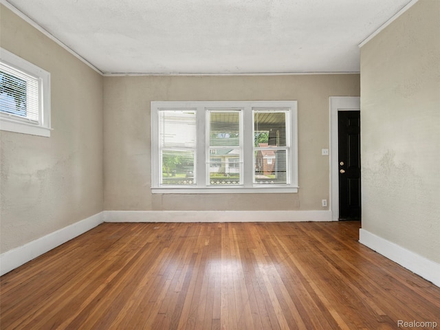 12667 Lauder St, Detroit, MI 48227 - empty room with hardwood / wood-style floors, plenty of natural light, and crown molding