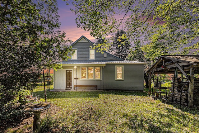 4293 N Schoenherr Rd, Fountain, MI 49410 - view of front of property featuring a front yard, a metal roof, and a gazebo