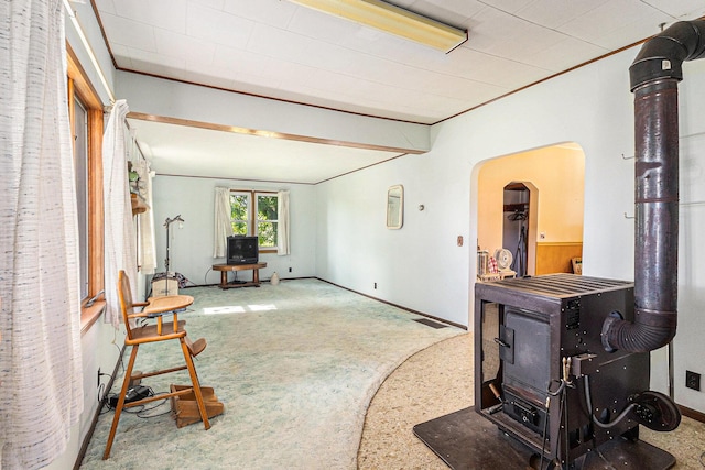4293 N Schoenherr Rd, Fountain, MI 49410 - living area featuring a wood stove and arched walkways
