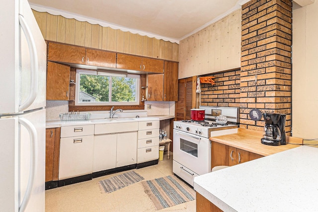 4293 N Schoenherr Rd, Fountain, MI 49410 - kitchen with white appliances, light countertops, brown cabinetry, and ornamental molding