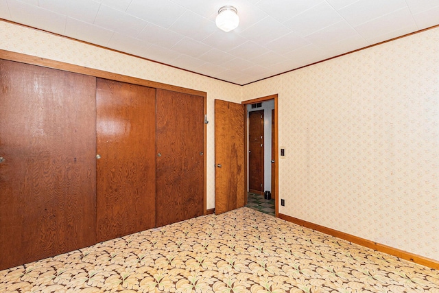 4293 N Schoenherr Rd, Fountain, MI 49410 - unfurnished bedroom featuring crown molding and a closet