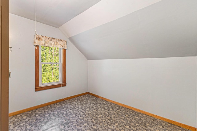 4293 N Schoenherr Rd, Fountain, MI 49410 - additional living space with vaulted ceiling and carpet floors