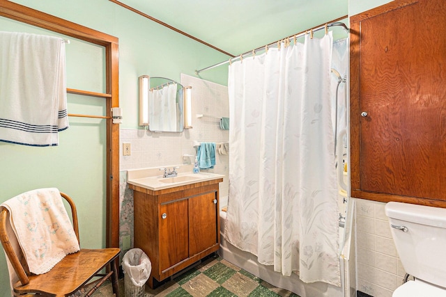 4293 N Schoenherr Rd, Fountain, MI 49410 - bathroom with tile walls, shower / bath combo with shower curtain, vanity, and tile patterned floors
