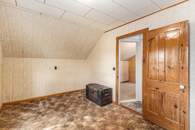 4293 N Schoenherr Rd, Fountain, MI 49410 - bonus room featuring vaulted ceiling, carpet, and wooden walls