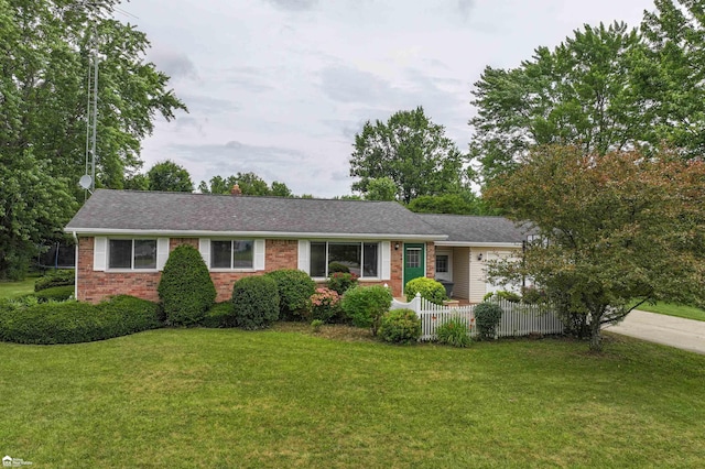 6494 W Coldwater Rd, Flushing, MI 48433 - single story home featuring brick siding, concrete driveway, a garage, a chimney, and roof with shingles