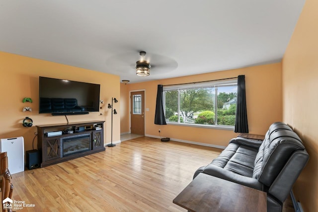 6494 W Coldwater Rd, Flushing, MI 48433 - living area with wood finished floors and ceiling fan