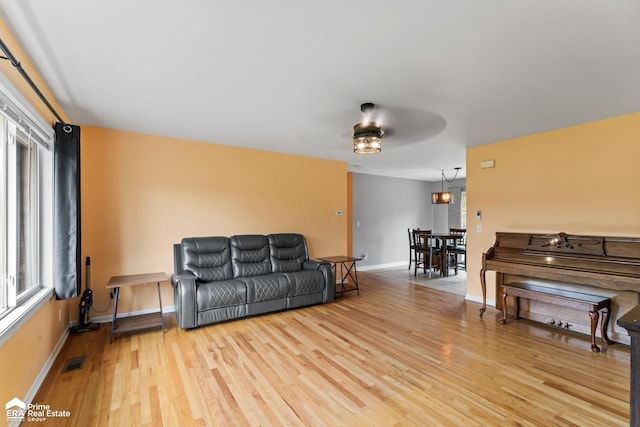 6494 W Coldwater Rd, Flushing, MI 48433 - living room featuring light wood-style flooring and a ceiling fan