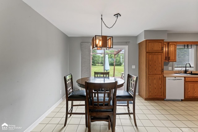 6494 W Coldwater Rd, Flushing, MI 48433 - dining area with plenty of natural light, a chandelier, and light tile patterned floors