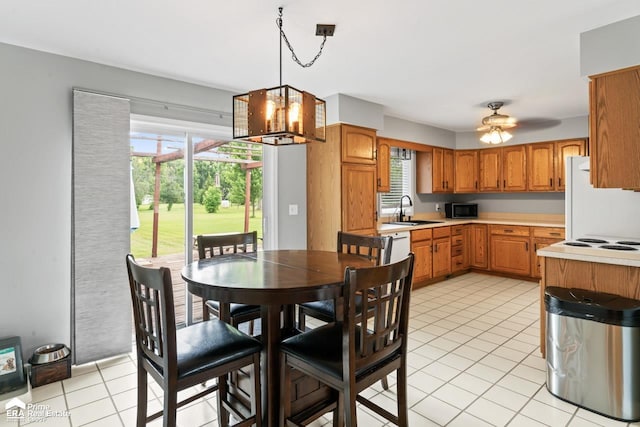 6494 W Coldwater Rd, Flushing, MI 48433 - dining space featuring a chandelier, light tile patterned flooring, and healthy amount of natural light