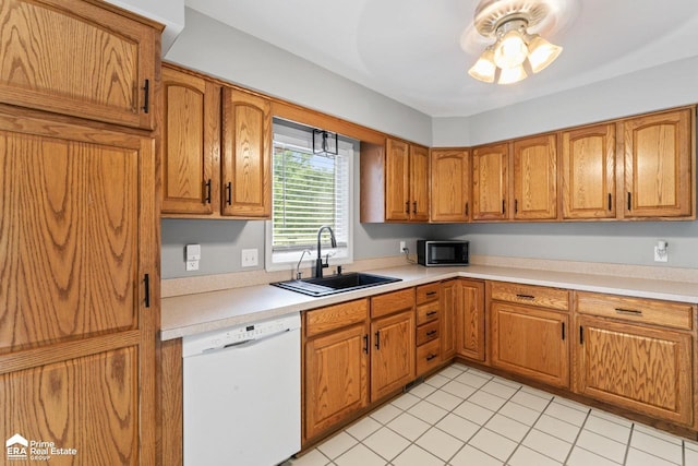 6494 W Coldwater Rd, Flushing, MI 48433 - kitchen featuring white dishwasher, black microwave, brown cabinets, light countertops, and a ceiling fan