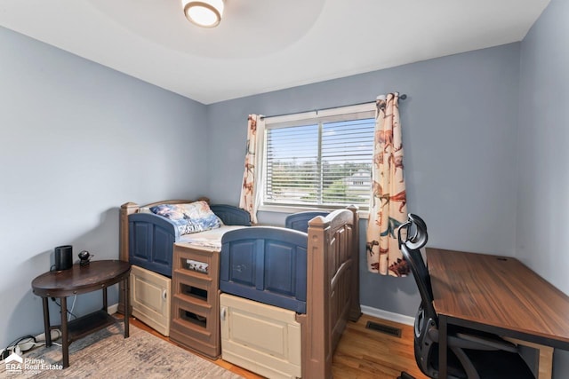 6494 W Coldwater Rd, Flushing, MI 48433 - bedroom with light wood-style floors